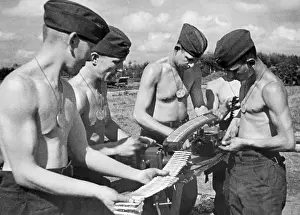 Tags: German soldiers strap ammunition, 1941