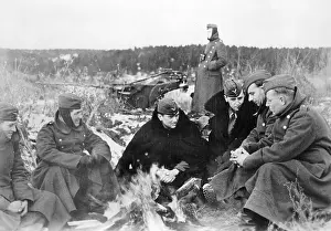 Campfire: German soldiers warm themselves at a fire on the Eastern Fro
