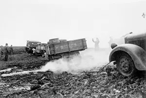 Morass: German tractor pulls a truck out of the mud on the Eastern F