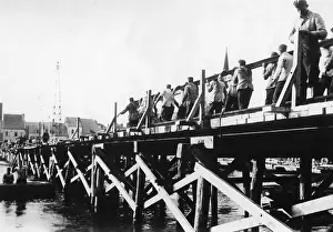 Makeshift: German troops building a makeshift bridge, 1940