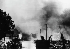 German Soviet: German troops in a burning city on the Eastern Front, 1941