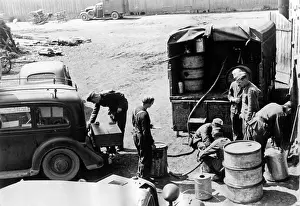 Refuel: German troops refueling their vehicles - Eastern Front