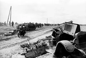 Sturmgeschuetz: German troops on a road during a battle of encirclement