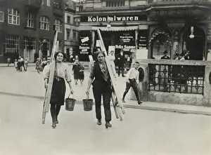 20 30 Years Old: German women window cleaners dressed for work carry