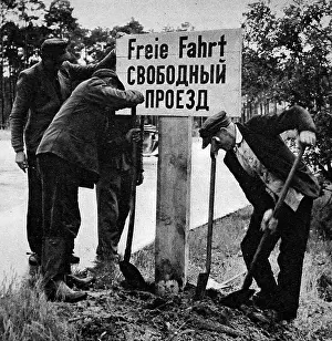 Conceded: German Workers Re-erecting a Free Passage Sign, Berlin, 19