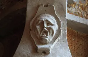 Rosso: Ghostly head with expression of despair in carved