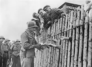 Death Camps: GI of the Seventh US Army gives his last cigarettes