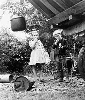 Littered: Gipsy boy and girl, eating out of doors