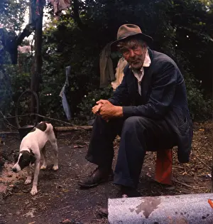 Crumpled: Gipsy man and his pet dog