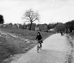 The John Krish Collection: Girl on a bicycle in a park