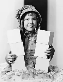 Spelling: Girl with blocks spelling buy now