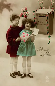 Posting: Girl and boy posting a letter