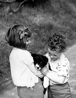 Girl and boy with puppy