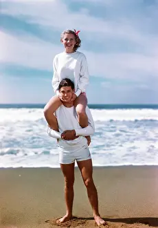 Piggyback: Girl On Boys Shoulders At The Beach