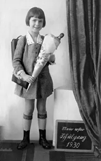Chalkboard: Girl with cone of candy, a custom on the first day of school