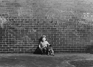 Graffiti: Girl and dog with wall of graffiti