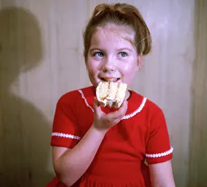 Gleeful: GIRL EATS A CAKE 1960S