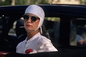 Buttonhole: Girl with goggles and white helmet. Horizontal format