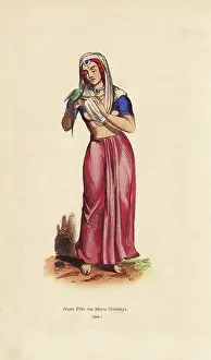 Himalayan: Girl from the Himalayan mountains playing with a parrot