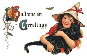 Haloween: Girl holding a Black Cat