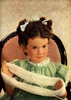 Dots: Girl Holding Loop of White Yarn