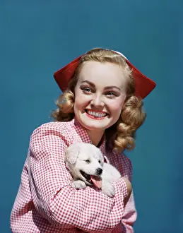 Checkerboard: Girl Holding Her Spitz Puppy