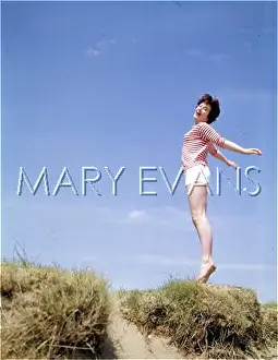 Ecstatic: Girl leaps up from a sand dune
