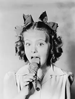 Indulge: Girl licking ice cream cone