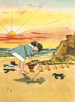 Sandcastles: Girl making sandcastles at seaside