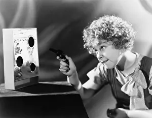 Ponder: Girl playing with a gun