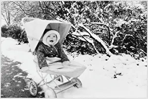 Pushchair: GIRL IN PRAM IN SNOW