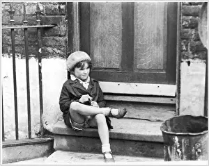 Dustbin: GIRL/RAINCOAT/DOORSTEP