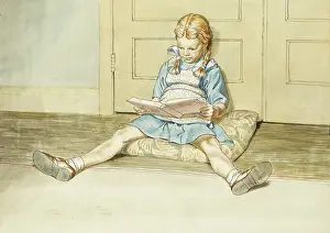 Pigtails: Girl reading whilst sat on a cuskion on the floor