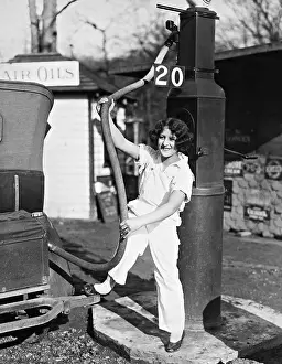 Benzine: A girl while refueling, 1932