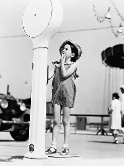 Thoroughfare: Girl standing on a weighing scale
