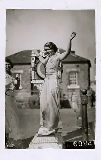 Snapped: Girl testing her weight on a seafront weighing machine