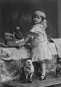 Stuffed: Girl with toy, 1909
