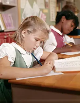 Schoolrooms: Girl Writing In School
