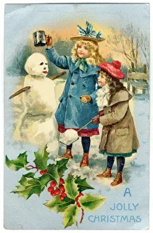 Crowning: Two girls crowning their snowman