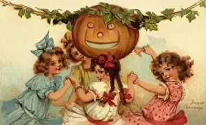 Haloween: Girls dancing around a Jack-o-Lantern