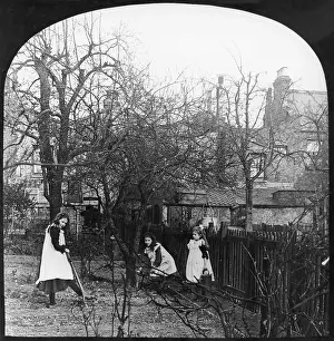 Smocks: Three girls digging in the garden