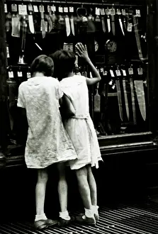 Browsing: Two Girls Looking in Store Window