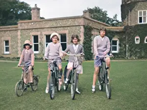 John Maclellan: Four girls riding bicycles