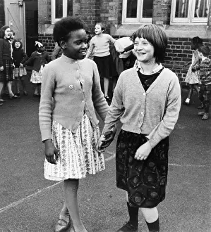 Sixtiesroger: Two girls in a school playground, Birmingham