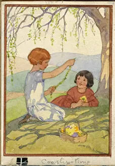 Cowslip: Two girls sitting under tree making cowslip chain