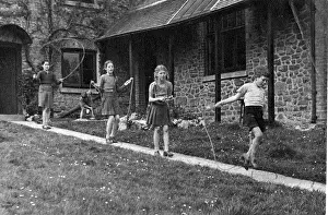 Skipping: Girls skipping down a path