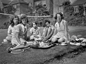Racquets: Five girls with tea tray in a garden