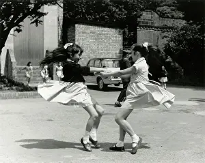 Whirl: TWO GIRLS WHIRLING ROUND