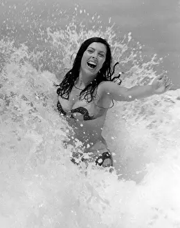 Glamour girl in the surf in Cornwall