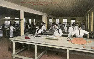 Aprons: Glove cutters at work, Gloversville, New York State, USA